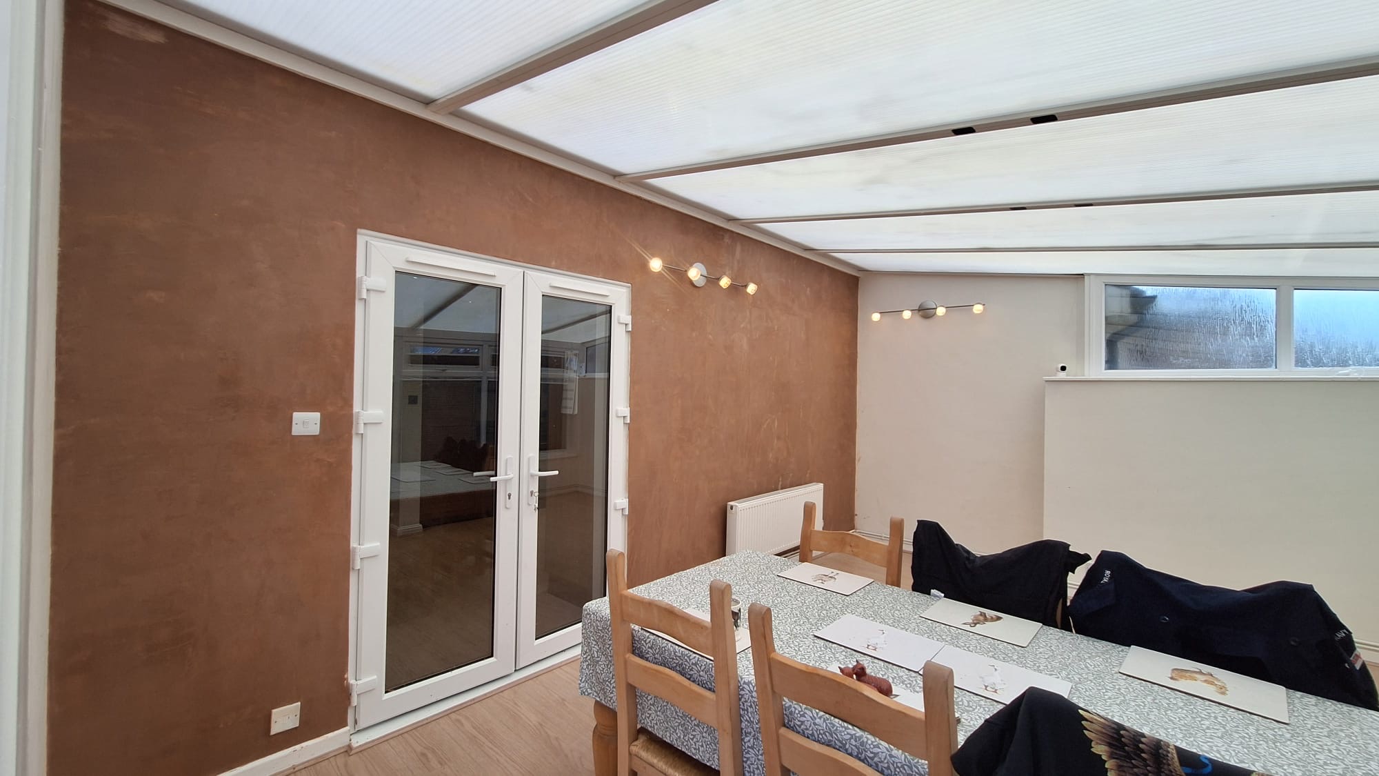 Decorative plaster finish wall in dining area